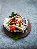 Prawns in coconut milk with baby corn and cherry tomatoes