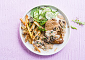 Steak with mushroom sauce and oven fries
