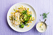 White fish with rice, broccoli, leek and cream sauce