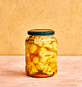 Pickled turmeric cauliflower in a screw top jar
