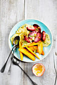 Exotic fruit salad with Victoria pineapple, wild mango, peaches and passion fruit