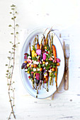 Vegetable plate with colourful carrots and chioggia