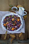 Autumn red cabbage salad with cherry tomatoes and nuts