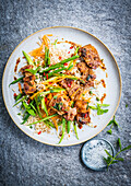 Marinated pork with rice, green beans and carrot strips