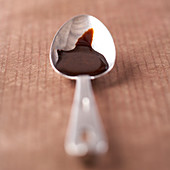 Spoon of melted chocolate