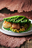 Scallops with chestnut in cabbage shells