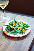 Salad of green beans, salicornia, flowers and salmon roe