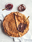 Rice milk pancakes with raspberry jam and chocolate spread