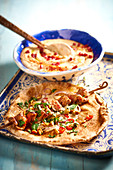Chicken brochettes on pitta bread and hummus,Oman cooking