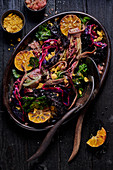 Dish of roasted vegetables with anchovies