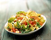 Mixed leaf salad with ham, cheese cubes and tomatoes