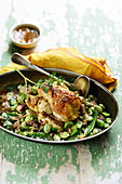 Small chicken with traditional mustard,sweet peas and broad beans