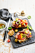 Grilled bacon,tomato,onion and basil crostinis