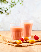 Vegetable drink with soy, kumquats, raspberries and pear