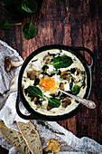 Shirred eggs with mushrooms,spinach and goat's cheese