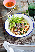 Chickpea salad with mizuna and mint leaves