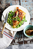 Lettuce salad and filo pastry samossas with honey
