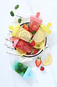 Strawberry,mint and lemon iced lollipops
