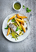 Salmon steak with potatoes and herb sauce