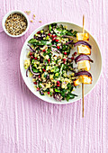 Grilled halloumi skewer with red onions and spinach salad with semolina
