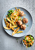 Lamb meatballs, homemade fries and carrot and lamb's lettuce salad