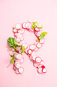 The letter R with pink radishes