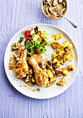 Chicken leg with mustard and fried potatoes