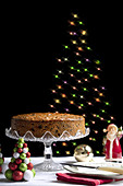 Traditional Christmas fruit cake and Christmas lights.