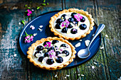 Blueberry and flower tartlets