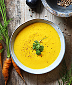 Cream of carrot soup with coriander and coconut milk