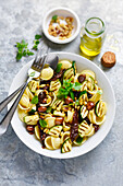 Orecchiette pasta, sun-dried tomato, olive, grilled courgette and pine nut salad