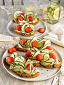 Cream cheese,watermelon balls and cucumber on toasts