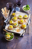 Mushrooms stuffed with fresh cheese and quail egg for aperitif