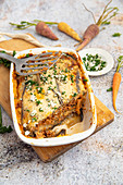 Vegetarian Moussaka with seitan, carrots, tomatoes, feta, herbs and olive oil