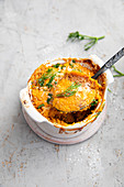 Beef Parmentier with mashed carrots, grilled onions and dill