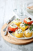 Tomatoes poached with spices stuffed with burrata