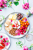 Aperitif dish to share : crisp vegetables,crackers,almonds,olives and cheese