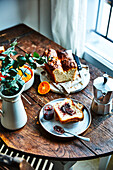 Vegan brioche bread with blackberry jam on a breakfast table