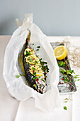 Mackerel stuffed with herbs and lemons cooked in paper