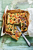 Quiche with broccoli, carrots, Beaufort and caraway seeds