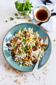 Whole grain basmati rice with chicken shreds, cashews and raisins