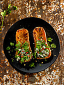 Stuffed grilled butternut squash with mesclun and cream cheese