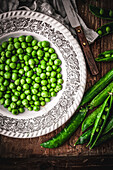 Fresh peas on an old-fashioned plate