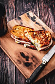 Grilled croque sandwich with melted cheese and turkey slices