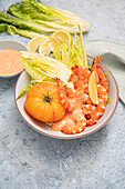Prawn cocktail with tomato, romaine lettuce and cocktail sauce