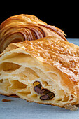 Close up shot of a pain au chocolatshowing the puff pastry