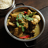 Chicken with curry and red chilies