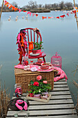 Pink decorated picnic by the lake
