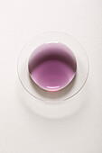 Violet syrup in a glass bowl