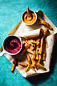 Sweet potato fries with spices and beet ketchup